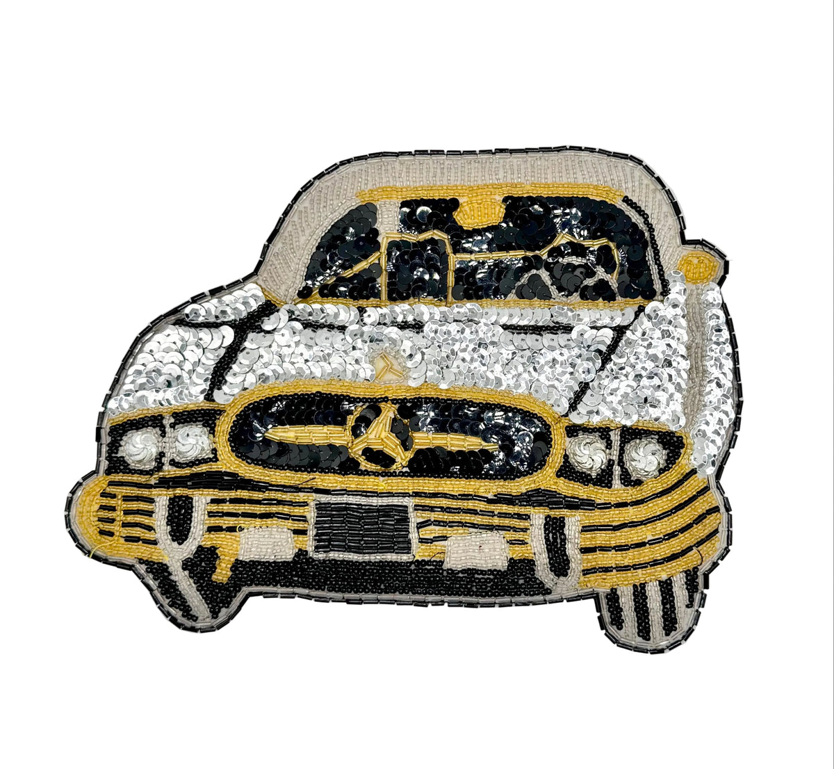 A vintage embroidered patch of a vintage Mercedes-Benz car, featuring black, white, and gold sequins on a white background.