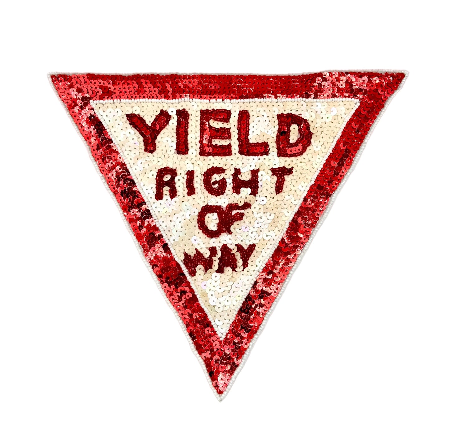 A triangular sequin patch designed like a road sign, featuring a red sequin border and a cream sequin center with the text 'YIELD RIGHT OF WAY' in red sequins.