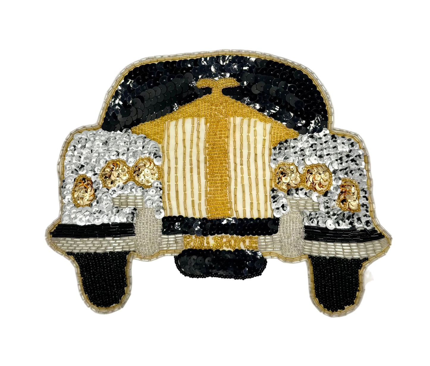 A vintage sequin and bead patch or applique made with black, white, and gold sequins and beads, shown on a plain white background.