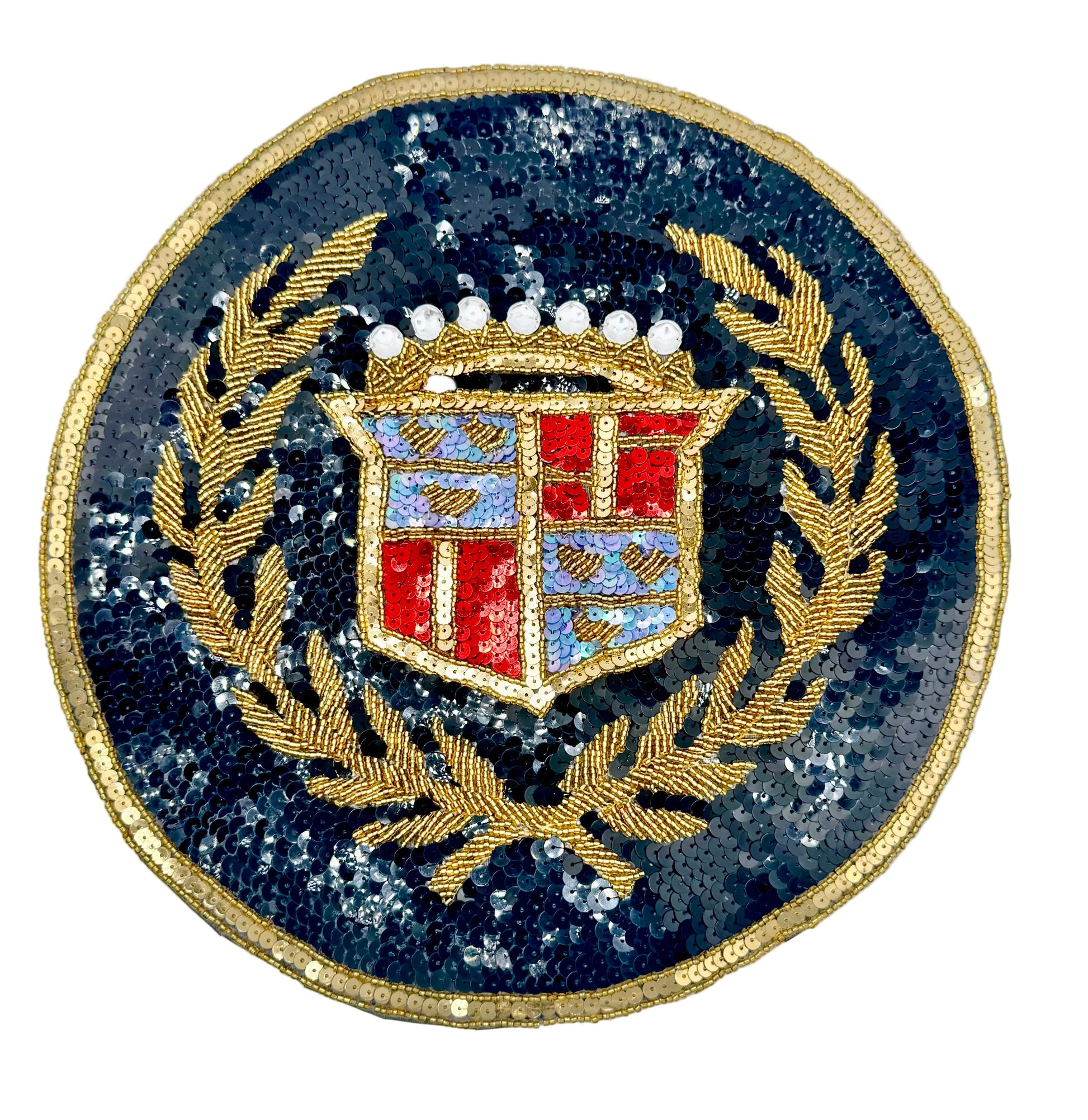 A circular vintage sequin and bead patch featuring a gold laurel wreath and a shield with red, blue, and white details, set against a black sequined background on a white backdrop.