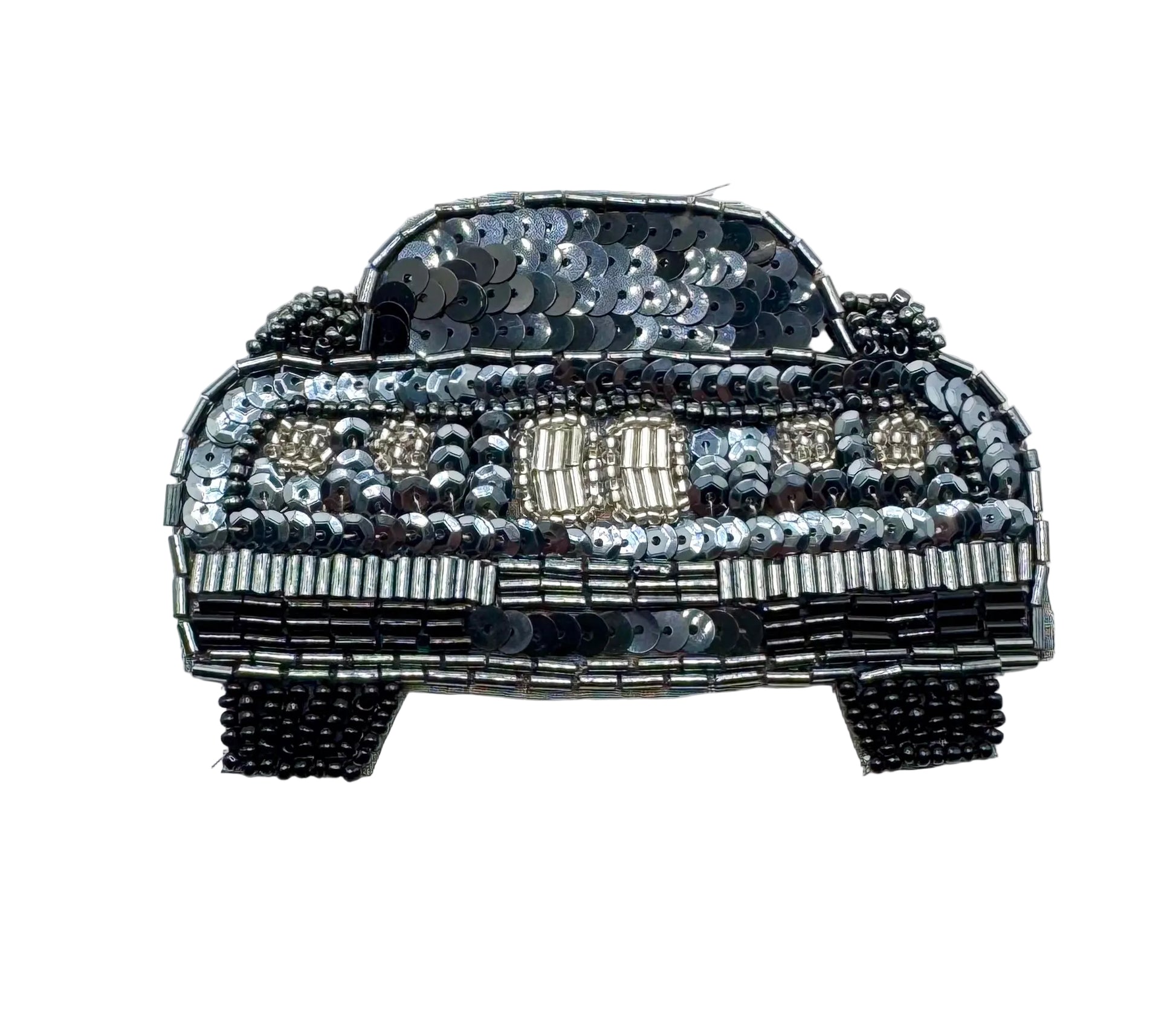 A decorative patch or applique shaped like a vintage car, covered in black, silver, and silver sequins and beads on a plain white background.