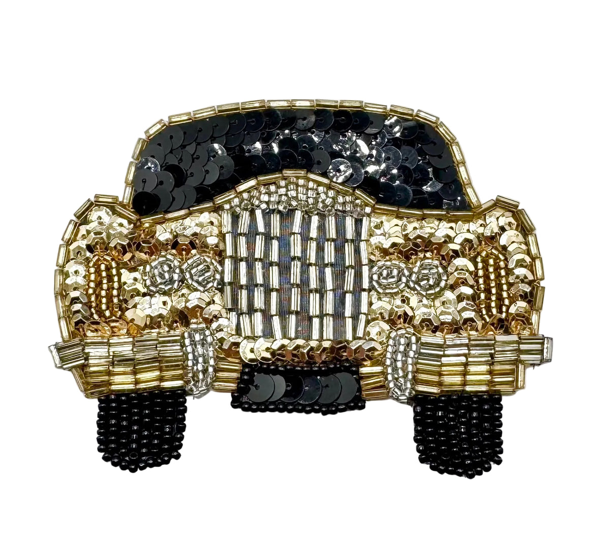 A decorative car-shaped embellishment or patch made from black and gold sequins, and beads, photographed on a plain light background.