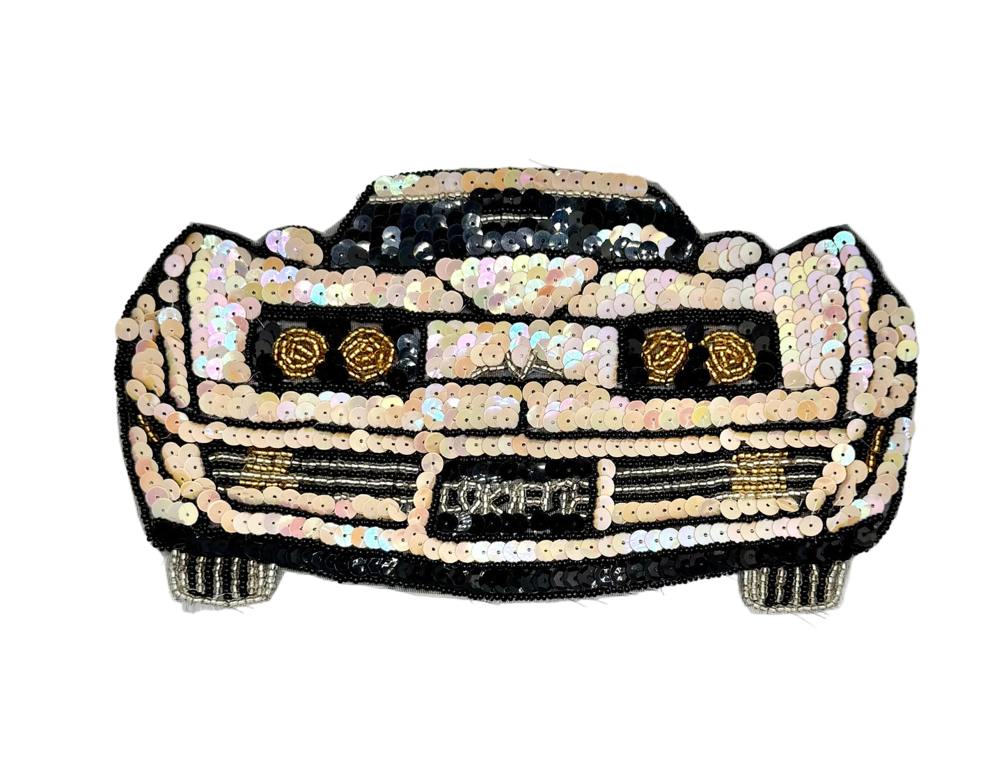 A car-shaped sequin patch featuring a black body with iridescent pink, beige, and gold sequins, and a silver grille, shown on a plain white background.