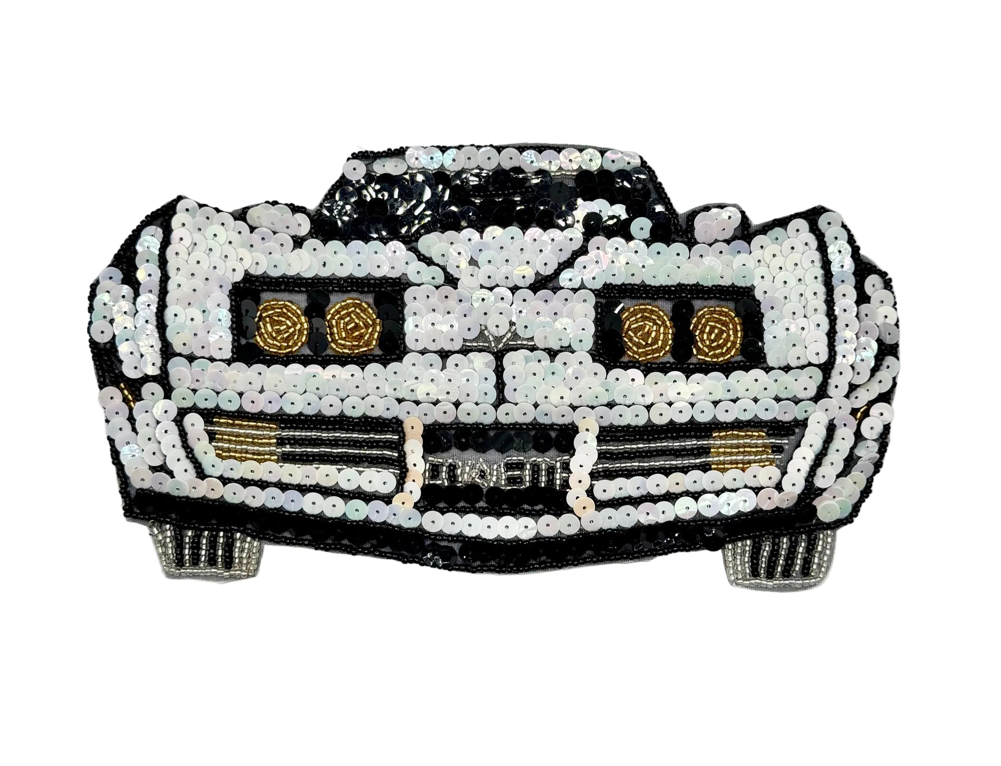 A vintage car-shaped sequin embellishment or patch featuring a black and white design with gold accents, including circular headlight details and a grille with the word 'CORVETTE' across the front.