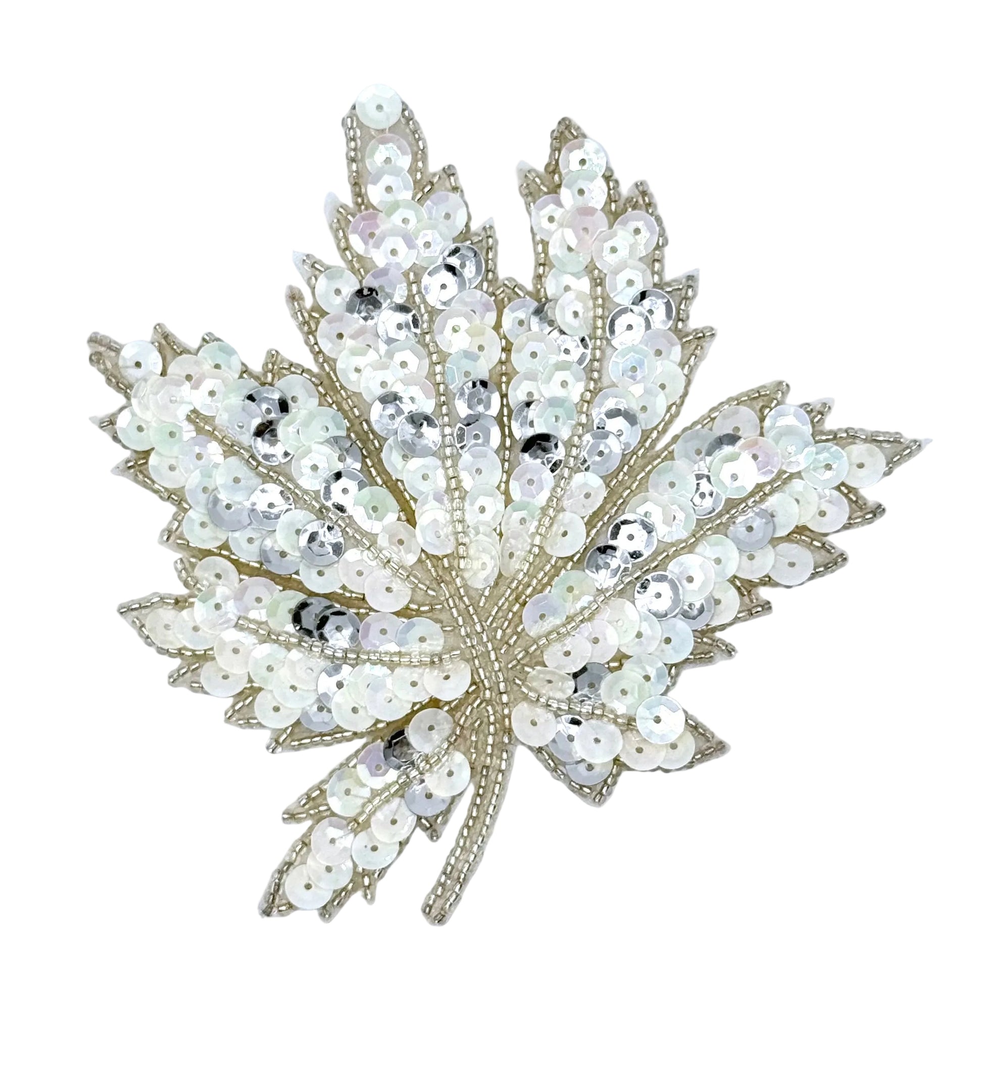 A sequined leaf-shaped embellishment with iridescent white and silver sequins and a silver bead outline, shown on a plain white background.