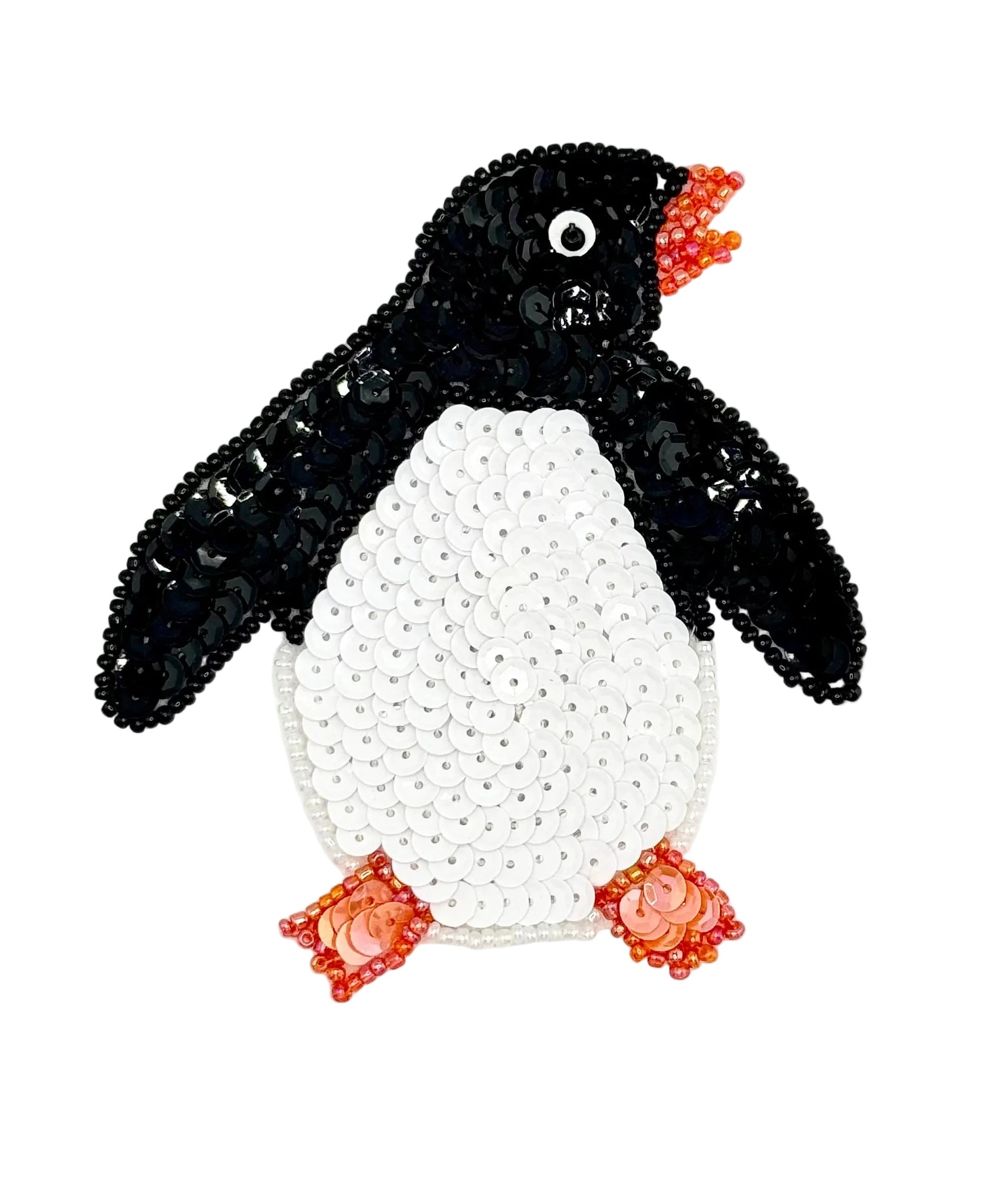 Penguin sequin applique with black and white sequins with black, white and orange beads on white background.