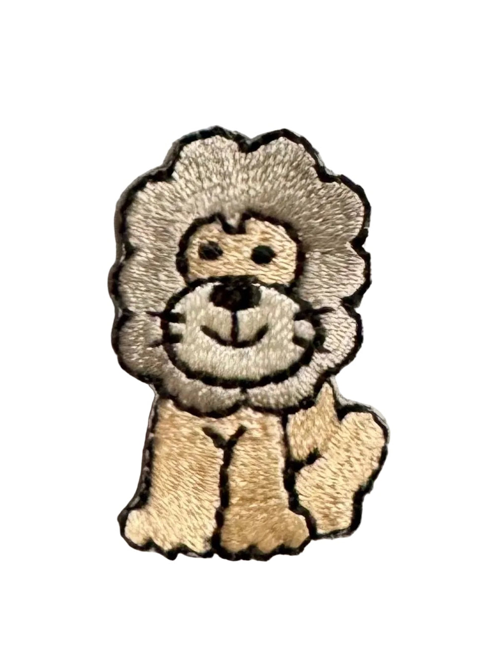 Embroidered lion sitting and smiling on a white background.