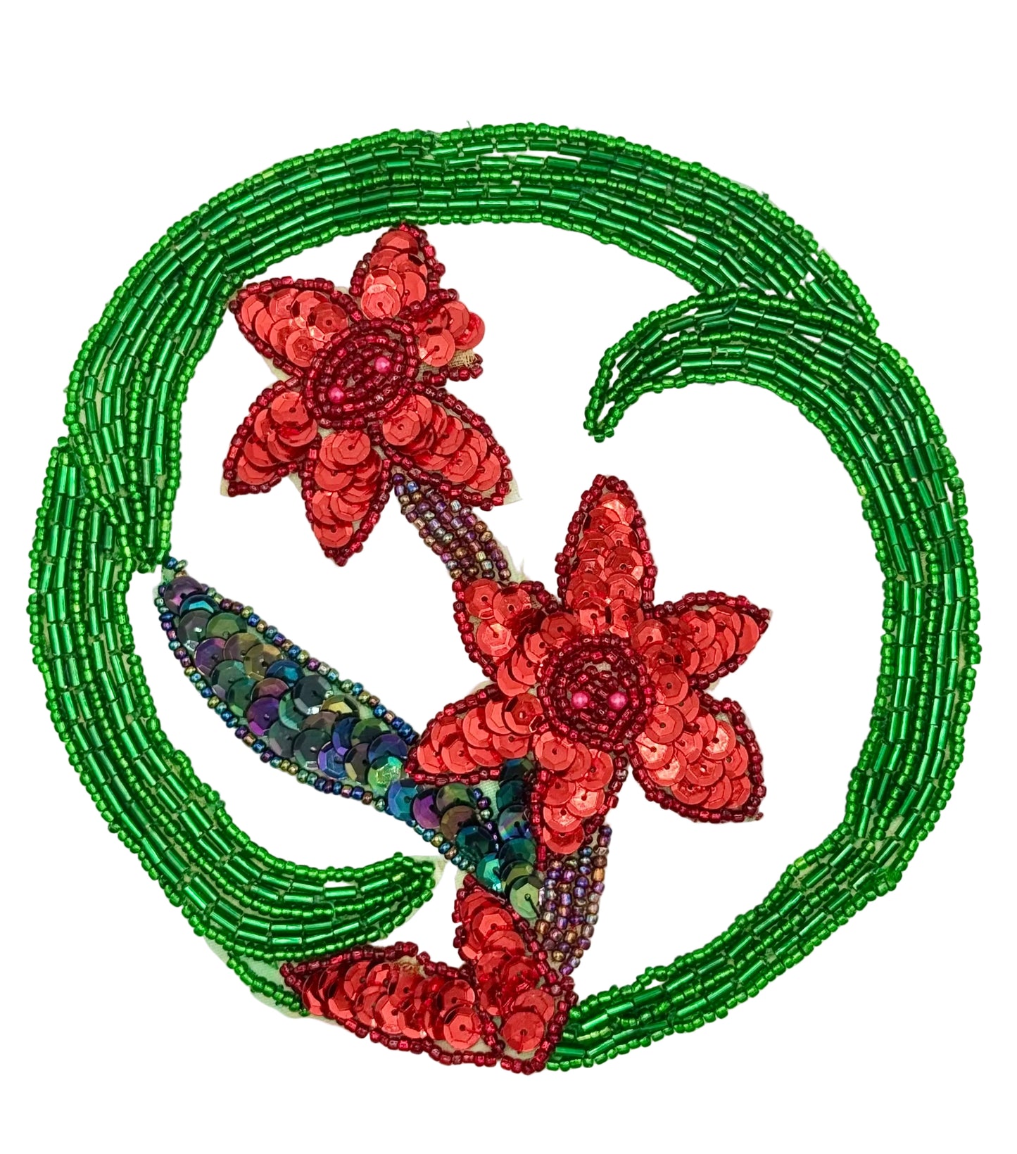 A circular beaded patch featuring two red sequined flowers and green beaded leaves on a white background.
