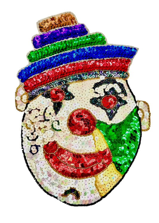 Colorful sequin patch of a clown with a white face, red nose, and multicolored hat on a white background.