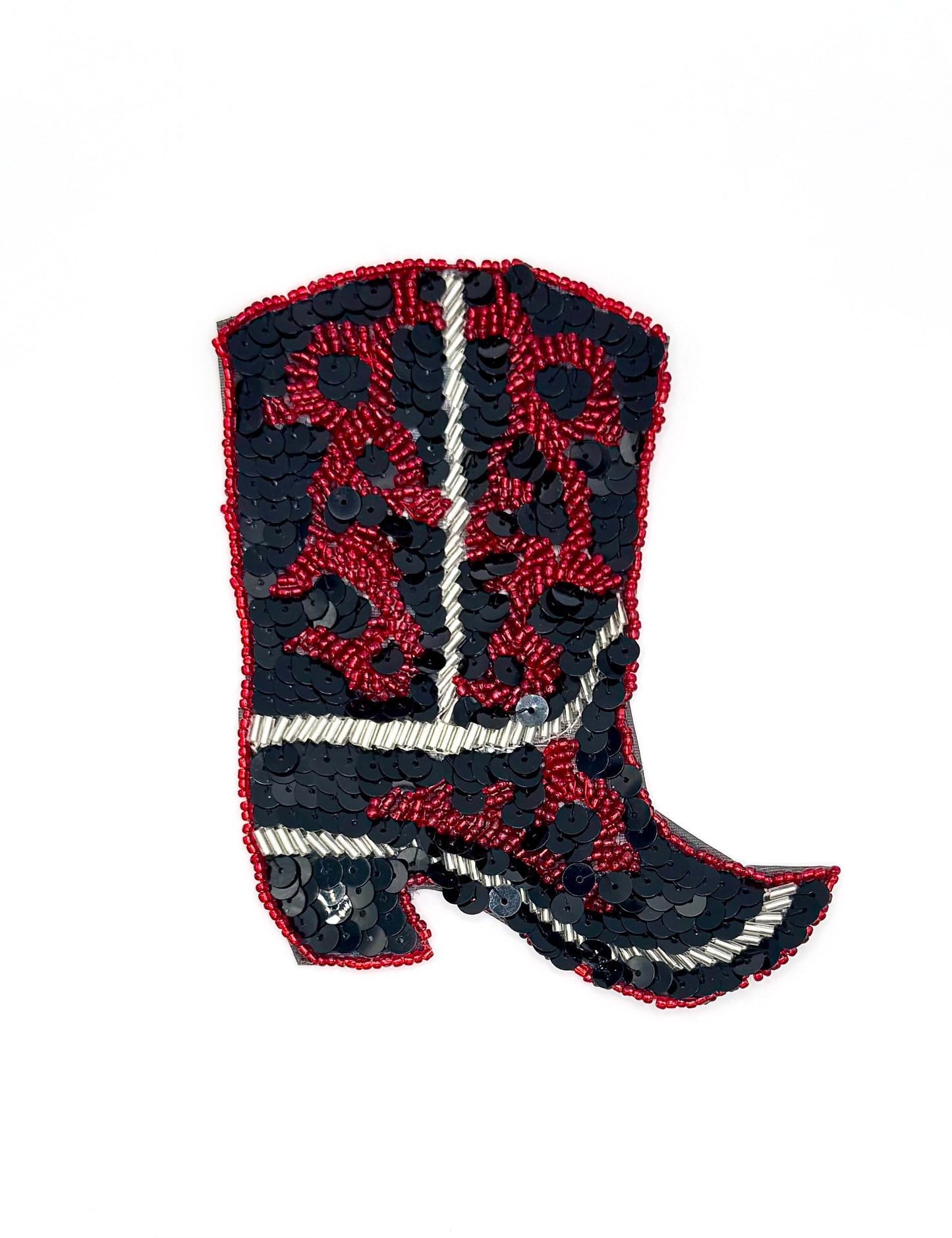 Decorative patch of a cowboy boot with red and black sequins and beads on a white background
