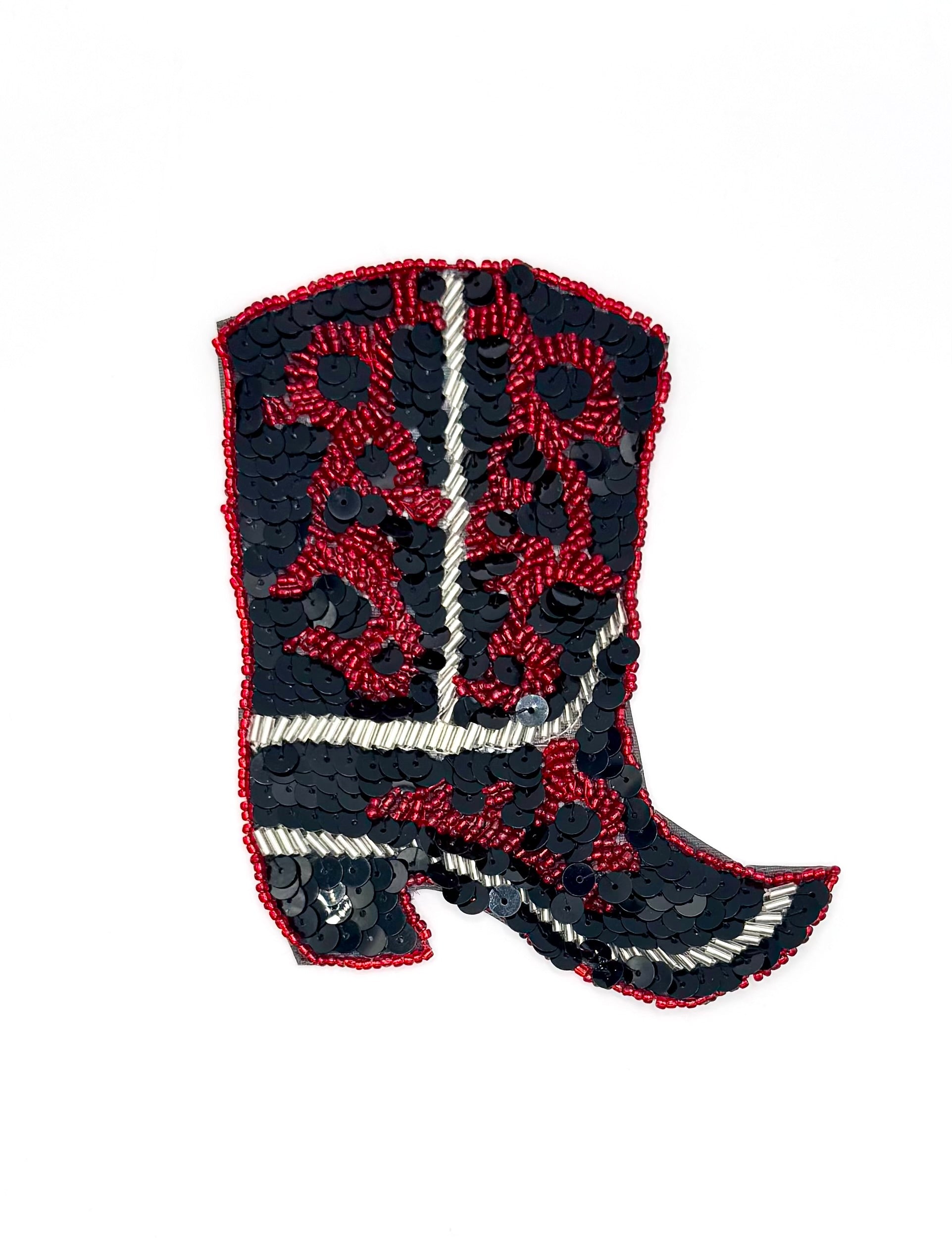 Decorative patch of a cowboy boot with red and black sequins and beads on a white background