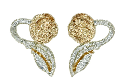 A pair of ornate floral embellishments featuring cupped gold and silver sequins and silver beadwork on a plain white background.