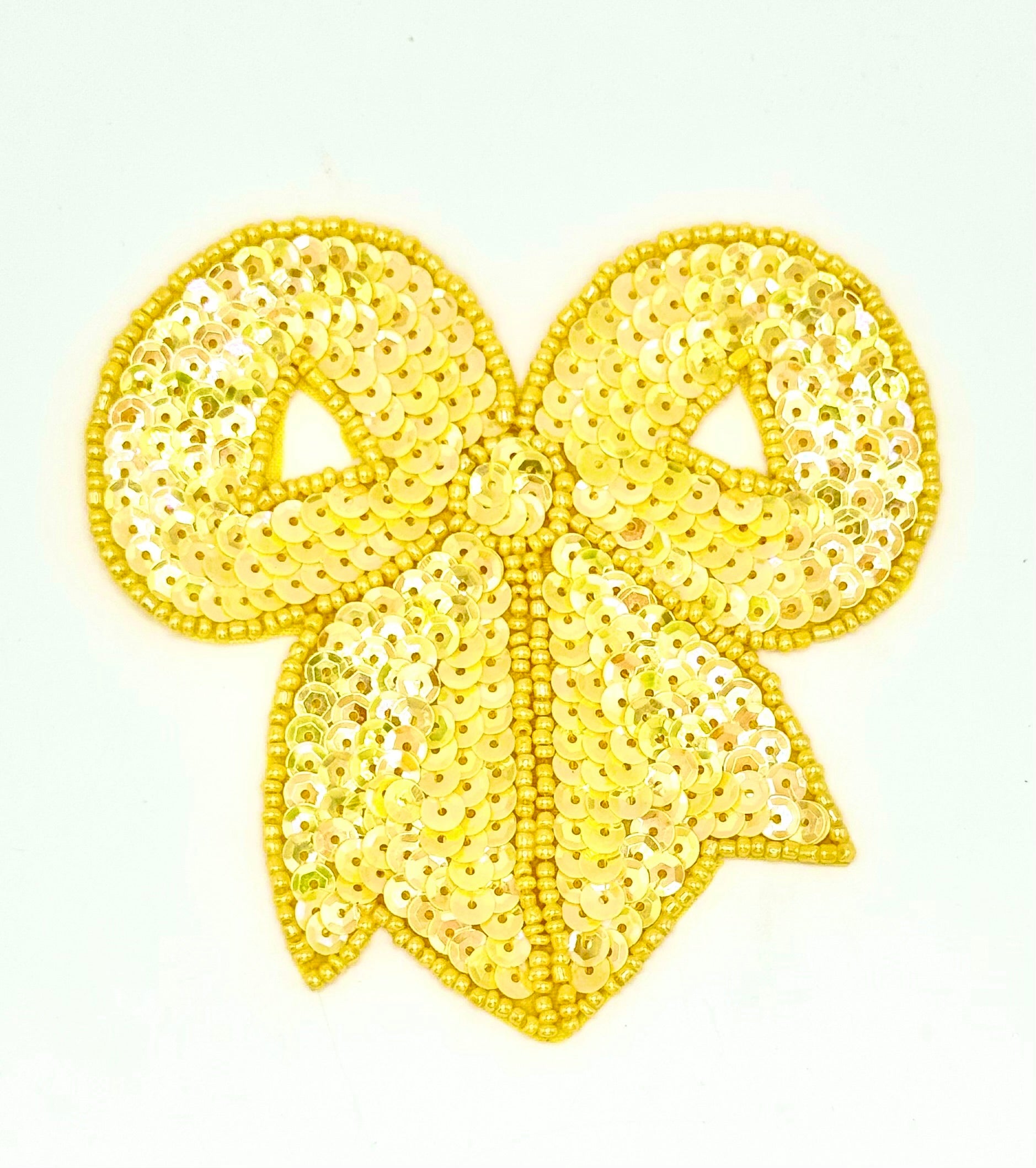 Yellow Sequin Bow on a white background