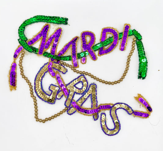 Decorative text 'Mardi Gras' in purple, green, and gold on a white background