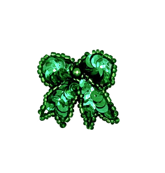 Green beaded sequin bow on a white background
