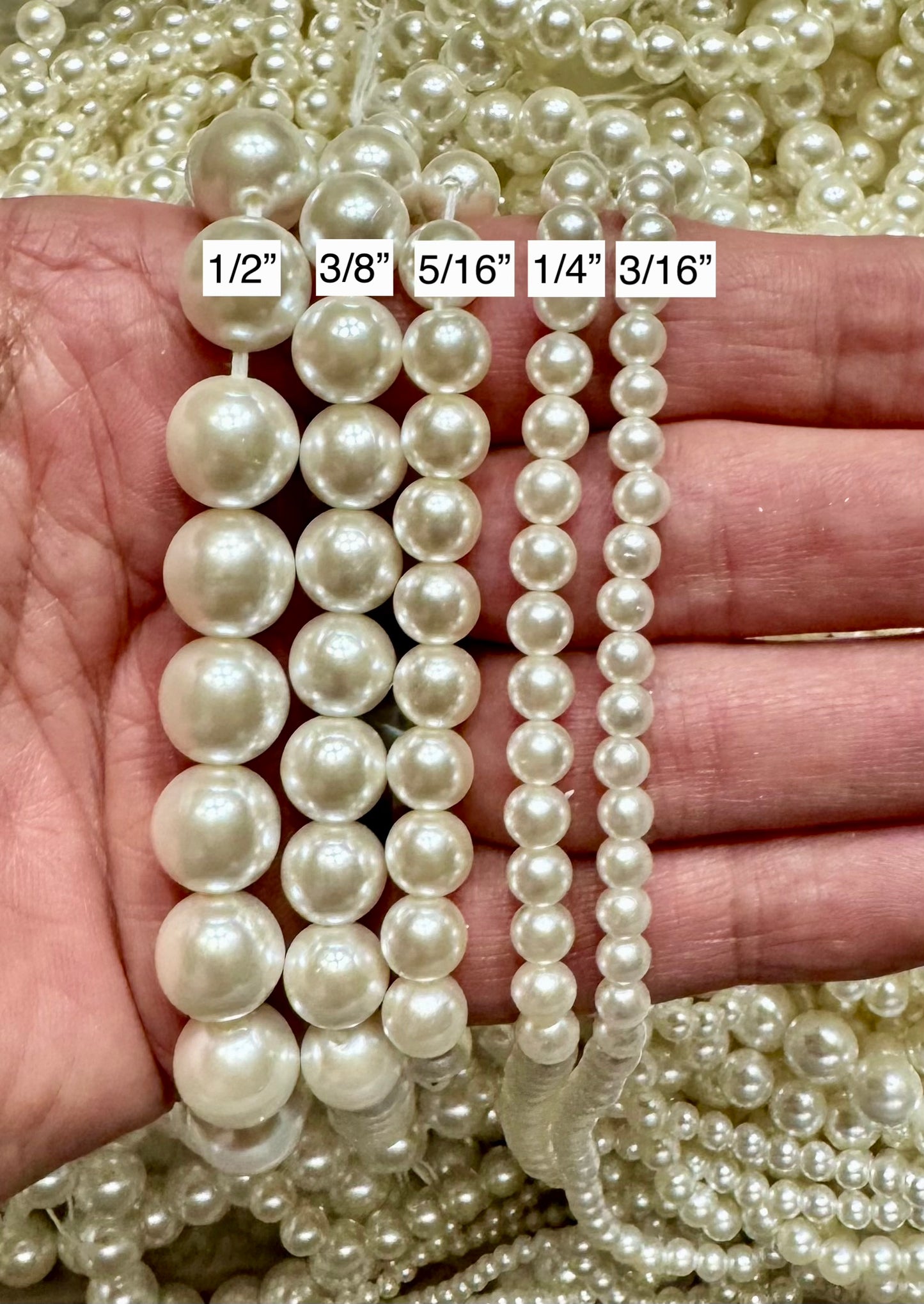 Loose pearls on a White String