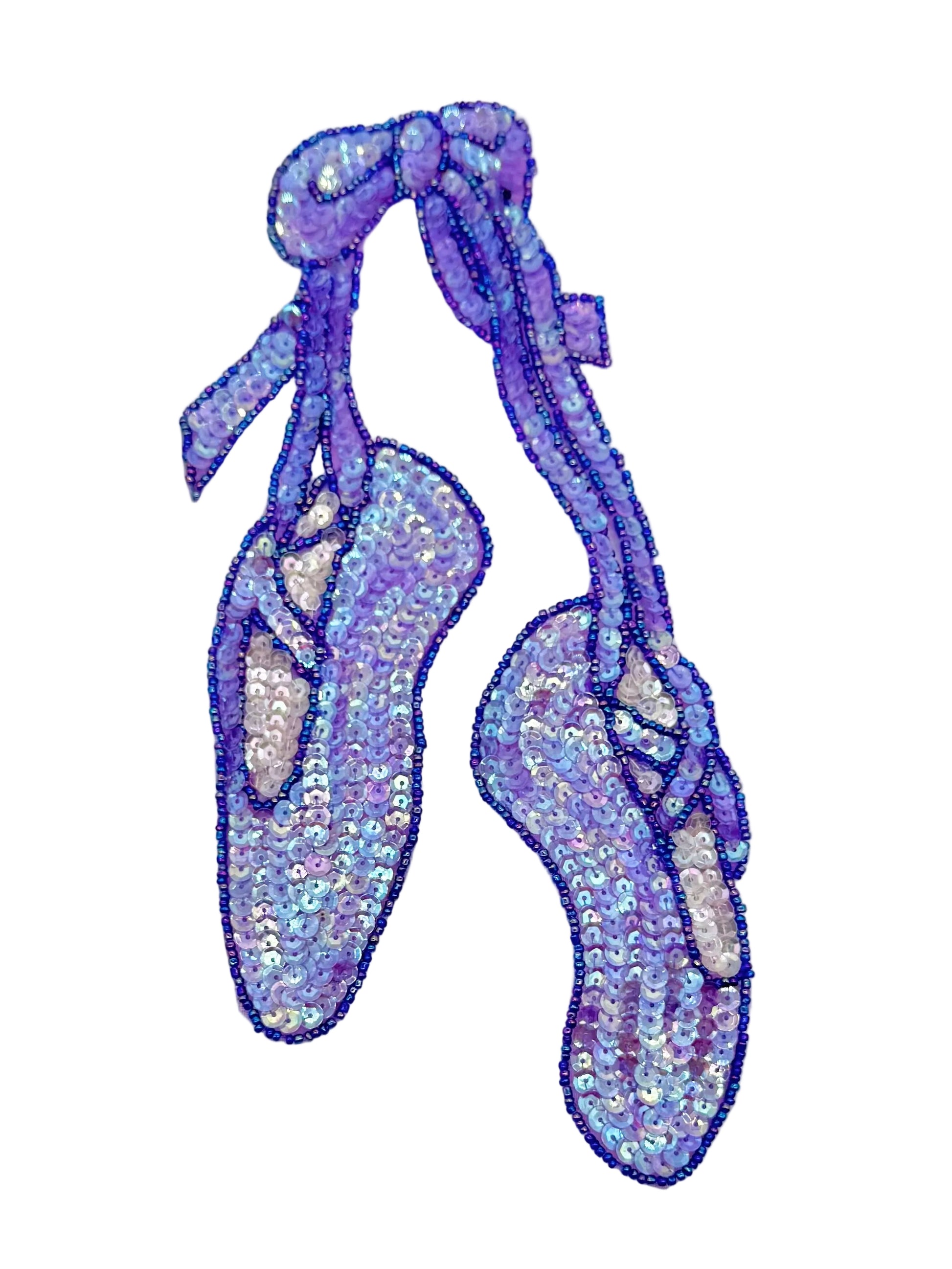 Sequined ballet shoes on a white background