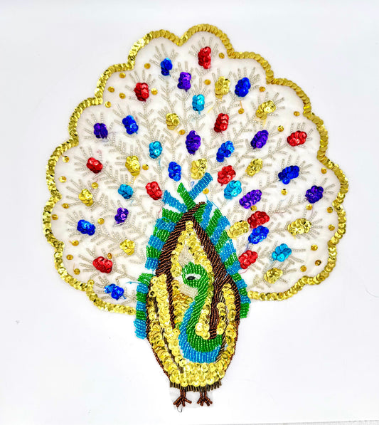 Decorative peacock with colorful beads and sequins on a white background