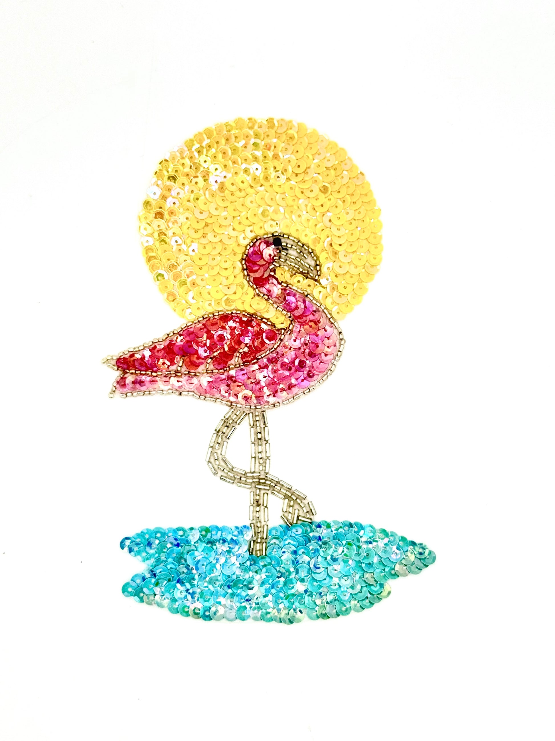 Sparkly flamingo in the water with a yellow sun in the background