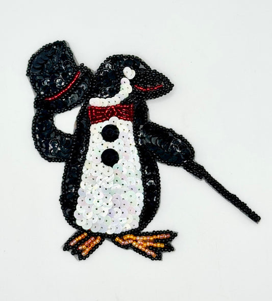 Sequined penguin design on a white background