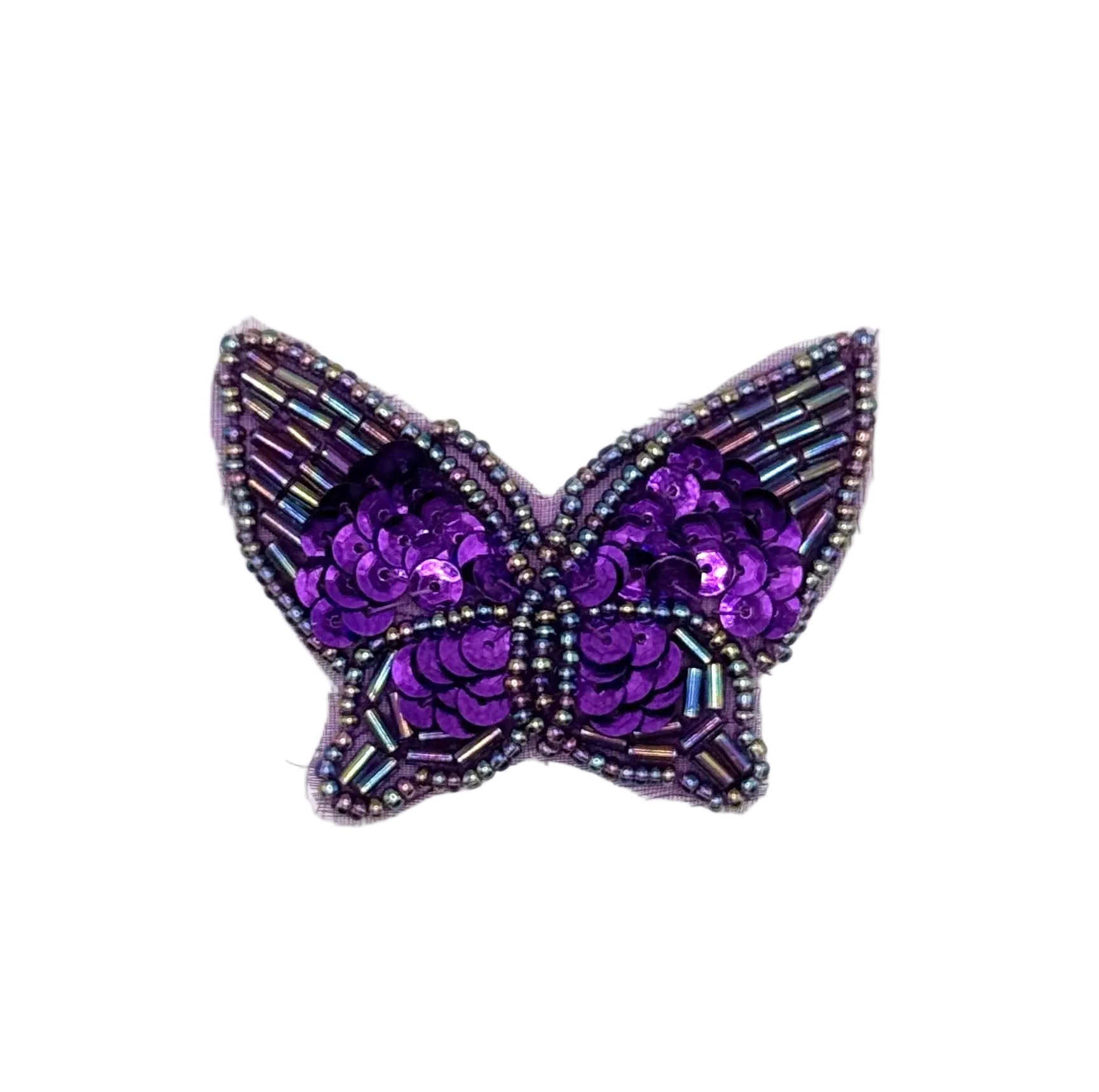 Purple butterfly-shaped decorative item with sequin and glass bead accents on a white background
