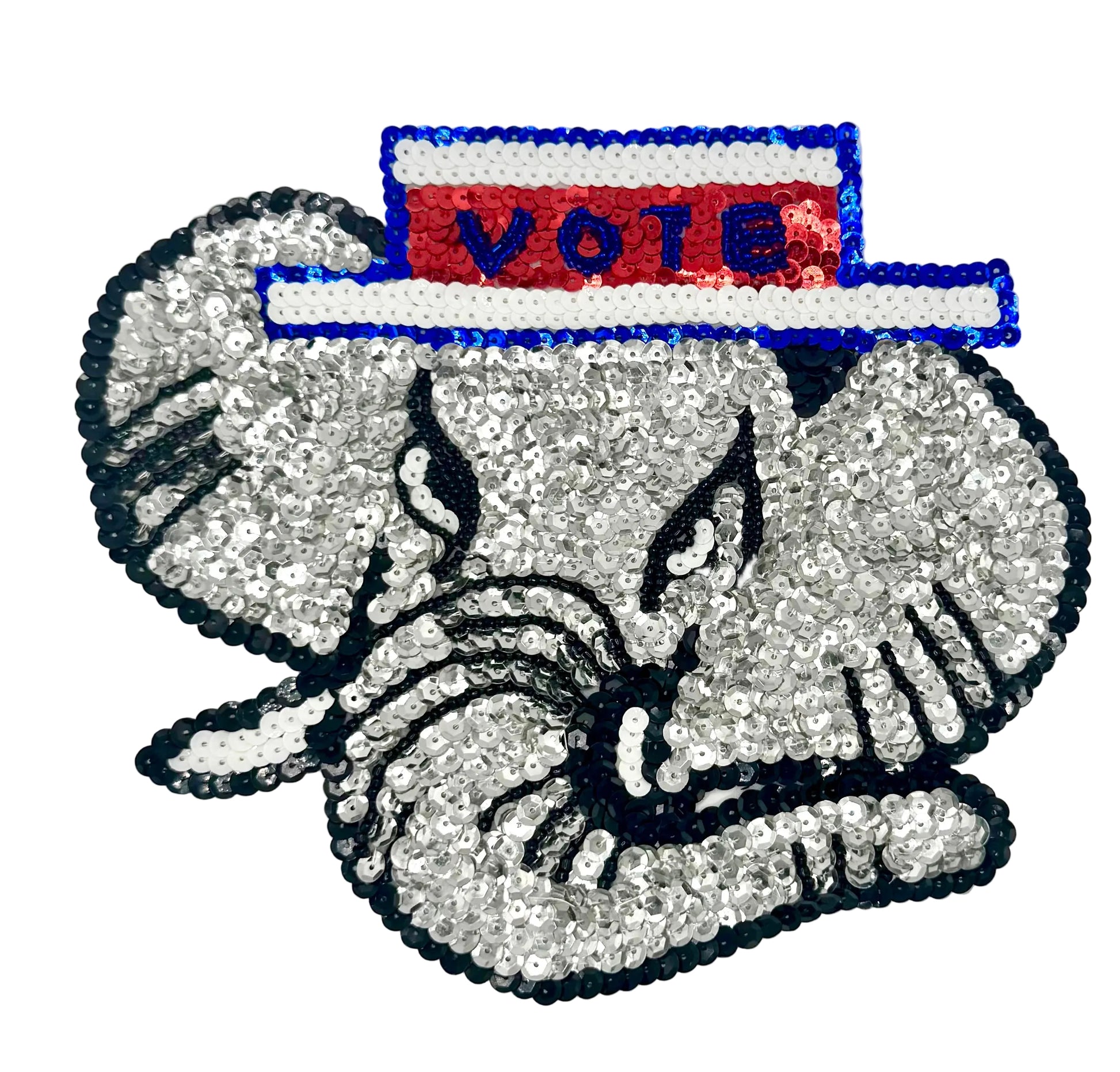 Sequined elephant wearing a 'Vote' sign on a white background