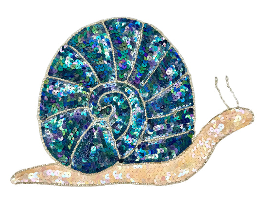 Sequined snail patch with blue and gold shell on a white background