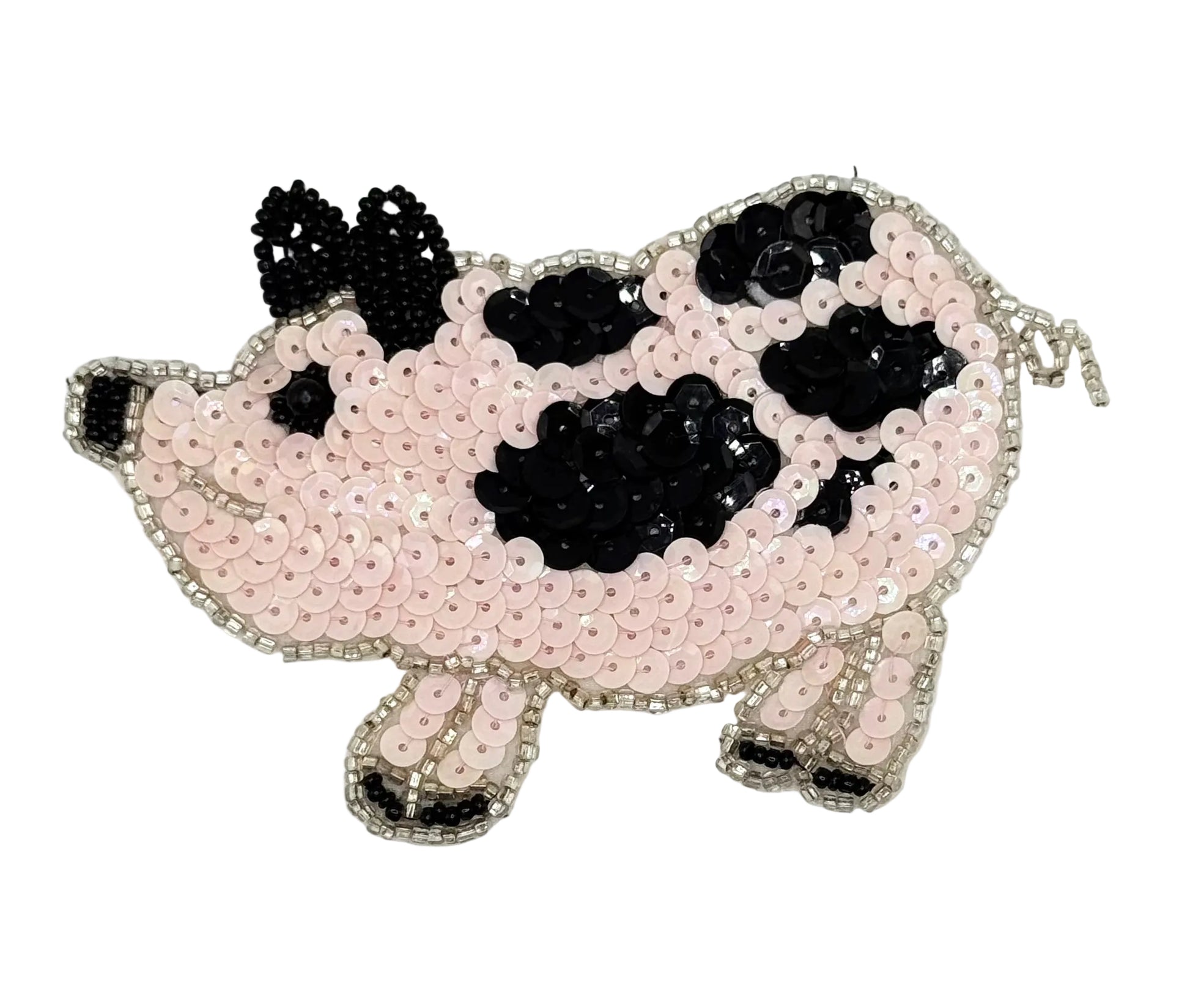 Beaded pink pig design on a white background