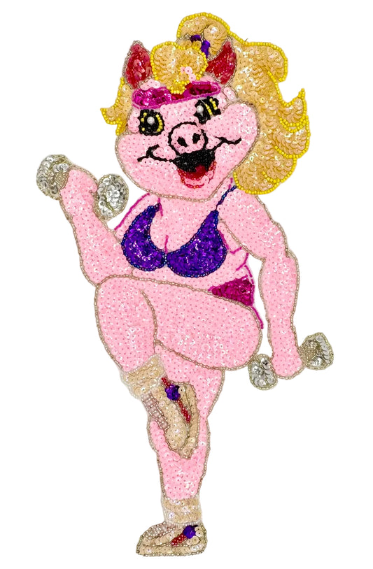 Sequined character of a pink pig with a purple top on a white background