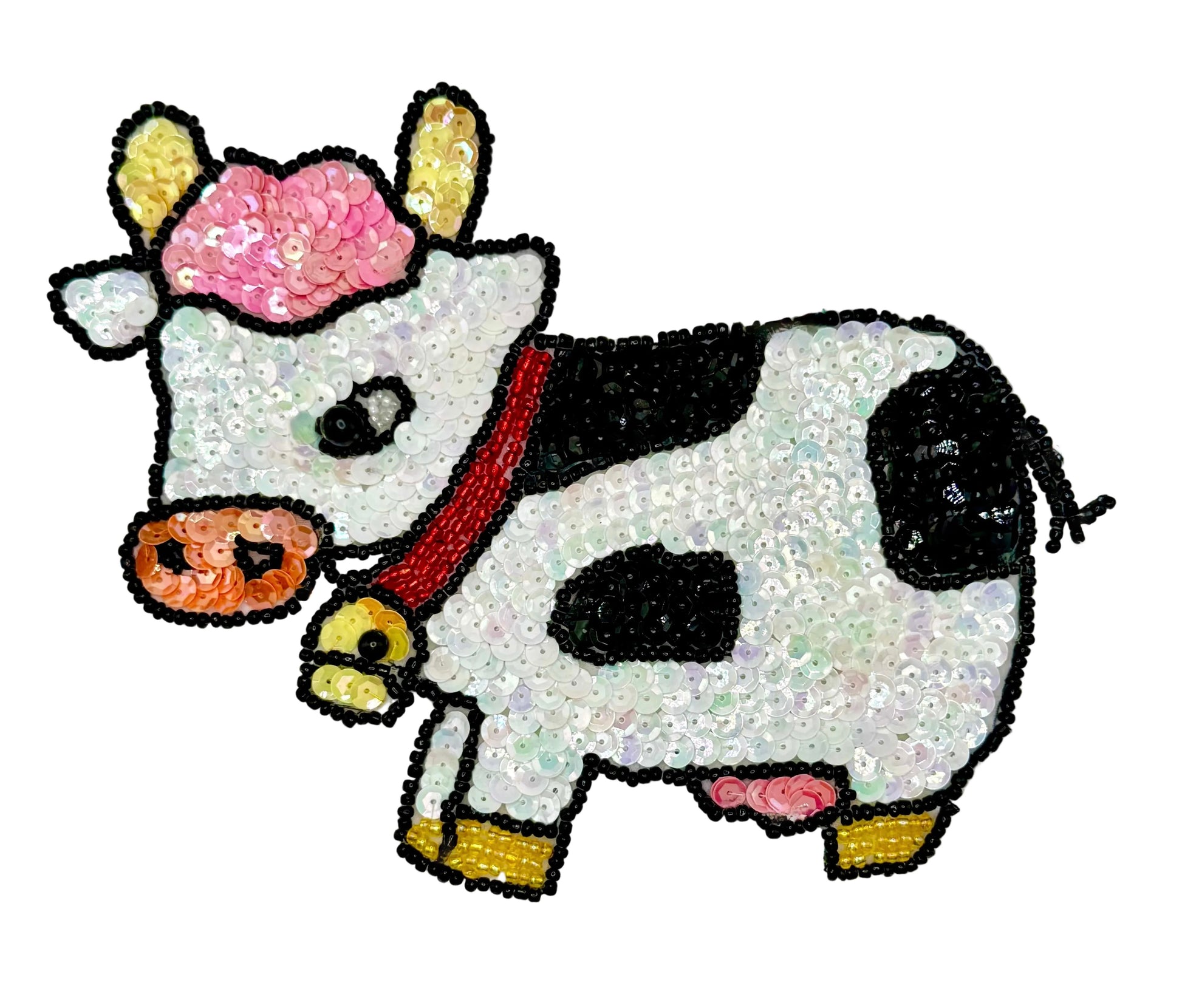 Decorative cow patch with sequins on a white background