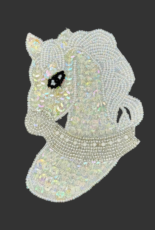 Iridescent beaded horse patch on a dark background