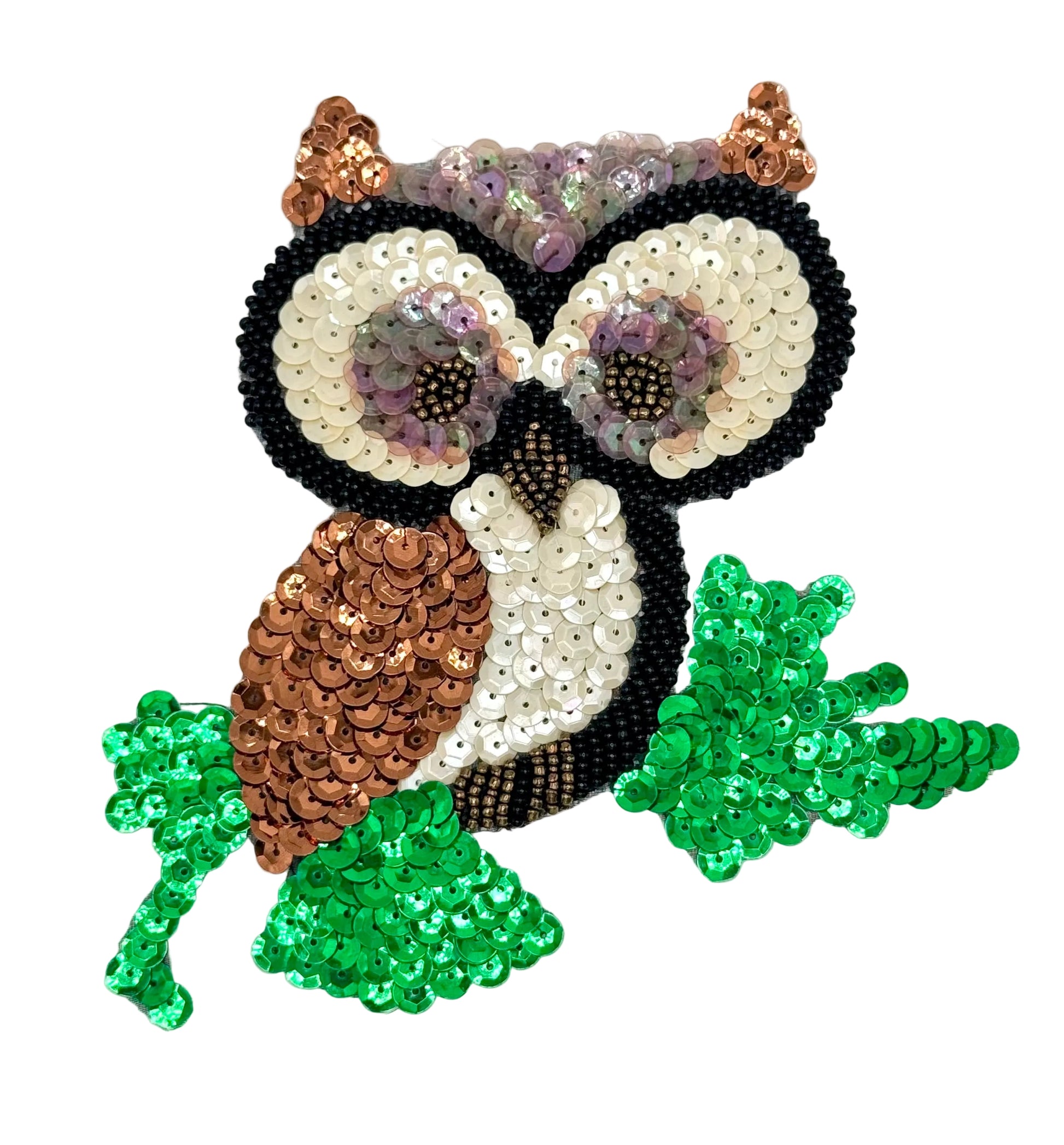 Sequined owl design with green leaves on a white background