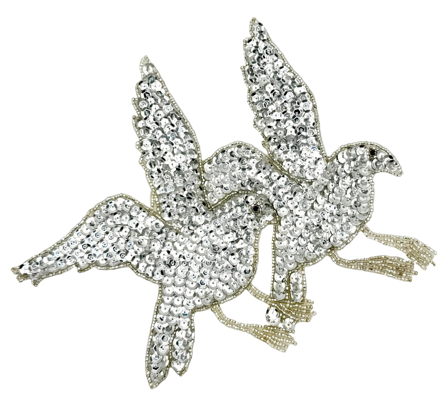 Birds flying with sequin and bead details on a white background