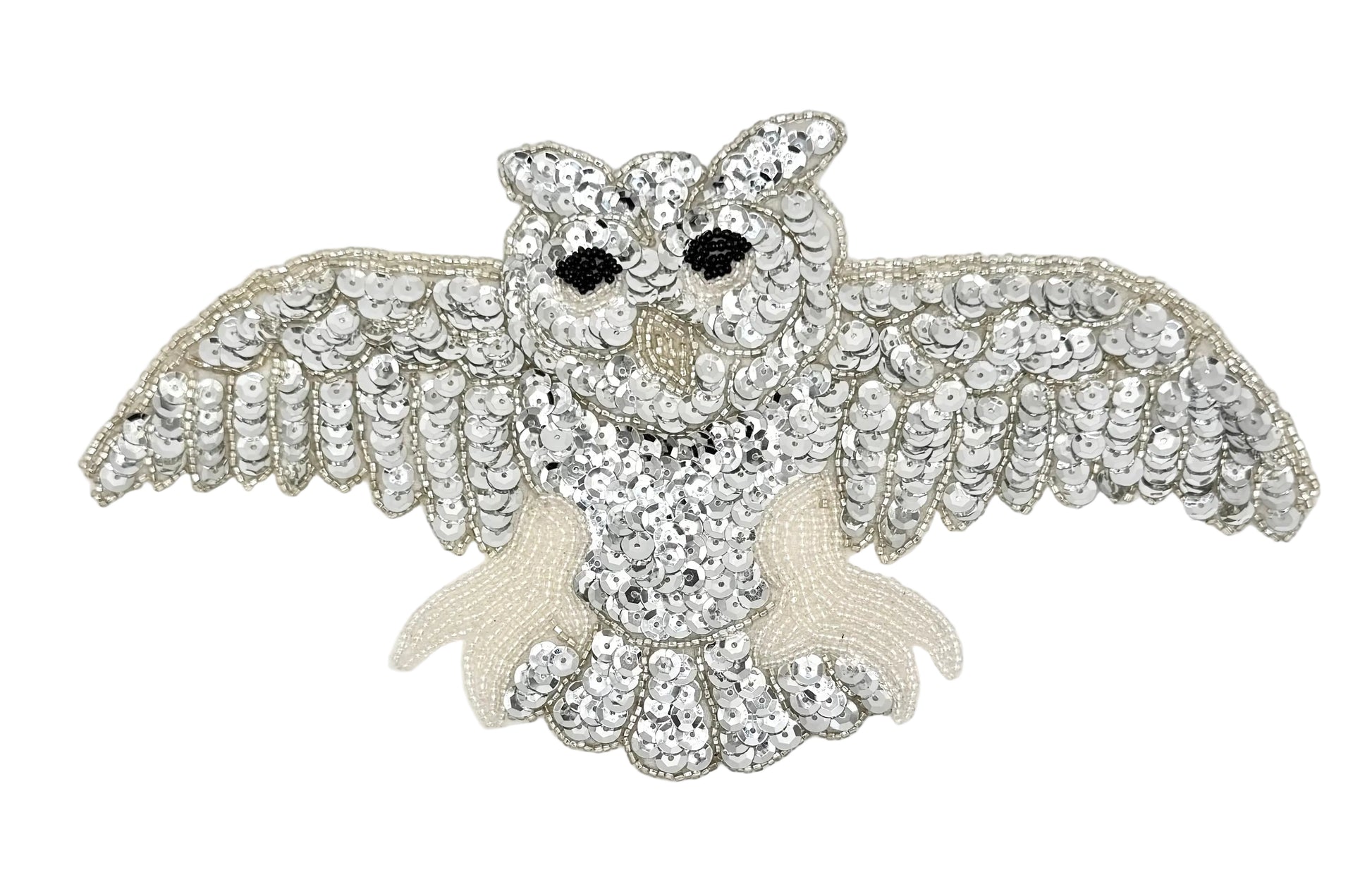 Decorative owl patch  with sequins and beads on a white background