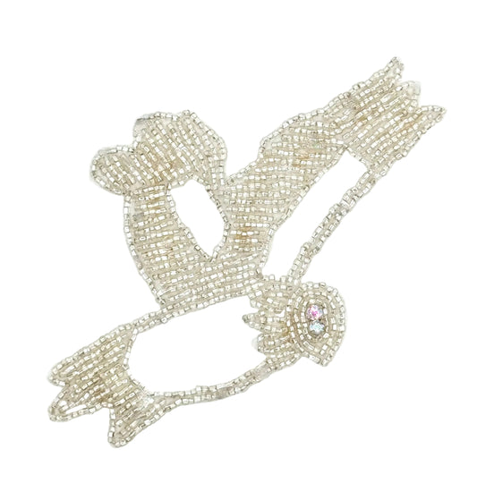 Decorative dove applique with AB rhinestones and silver beads on a white background