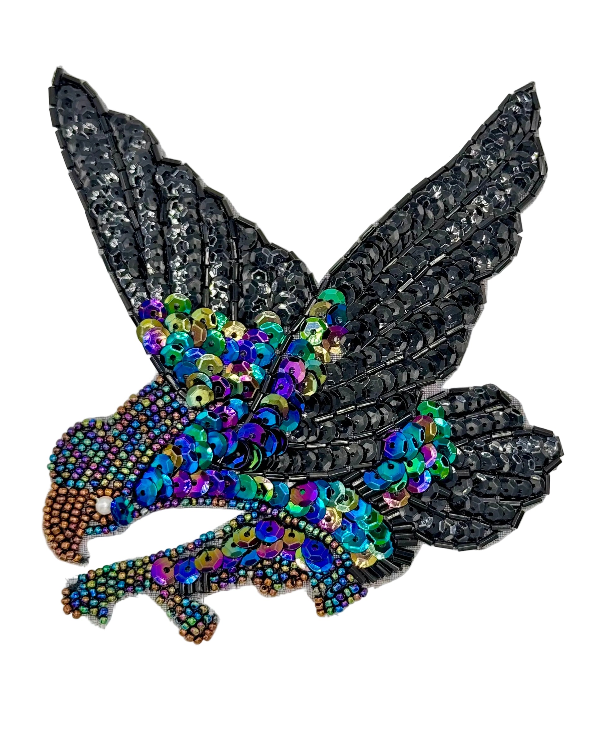 Decorative patch with sequined eagle design on a plain background