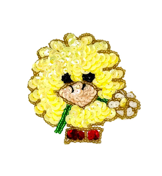 Sequined bird with flower and bow on a white background