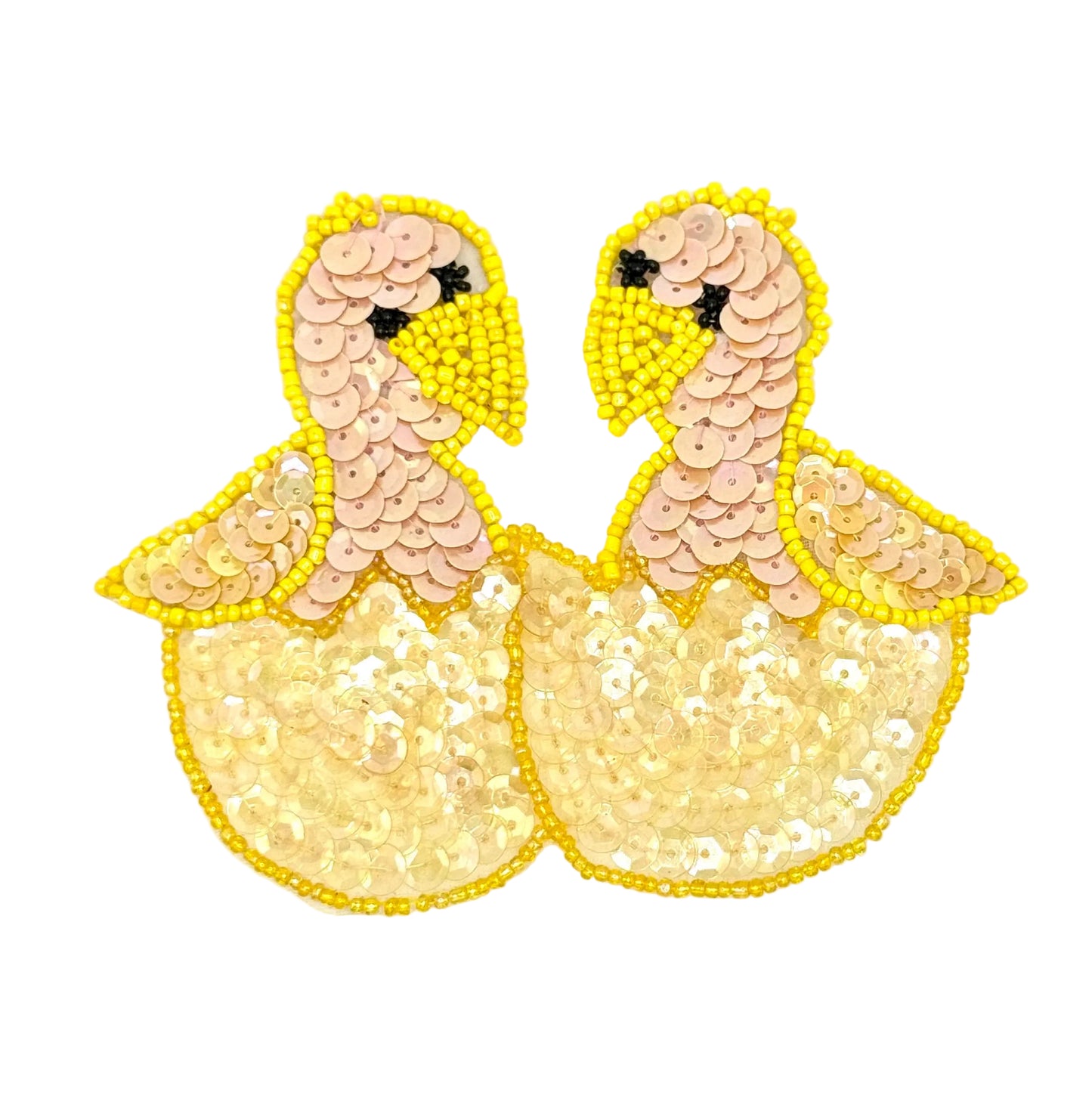 Sequined duck-shaped patches on a white background