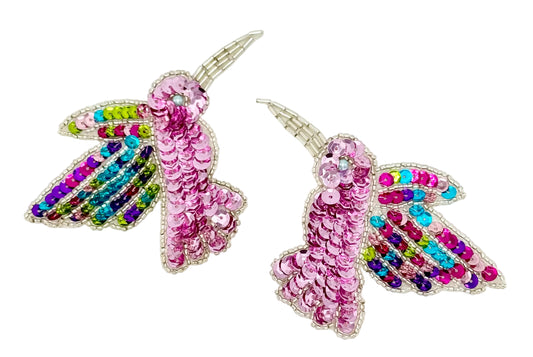 Colorful hummingbird pair patches on a white background