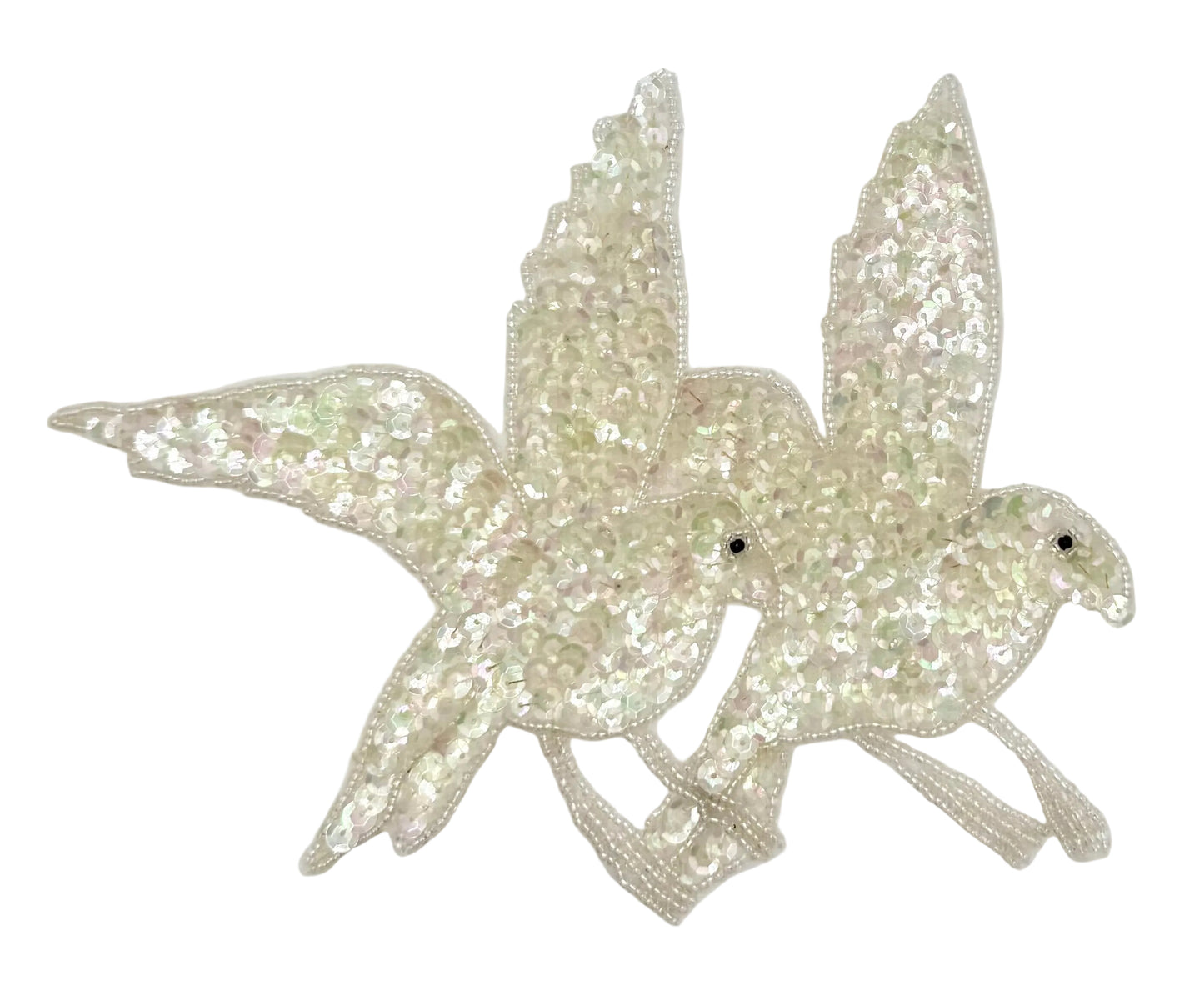 Two sparkling dove-shaped patches on a light gray background