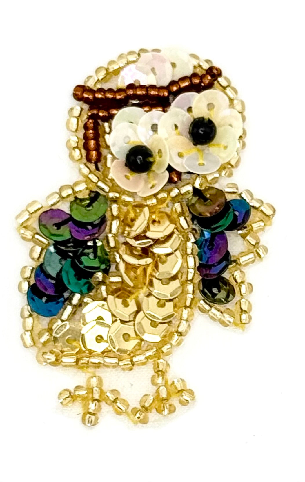Decorative owl patch  with sequins and beads on a white background