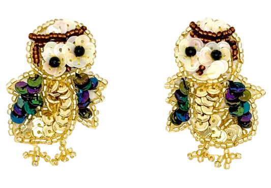 Pair of owl patches with sequins and beads on a white background