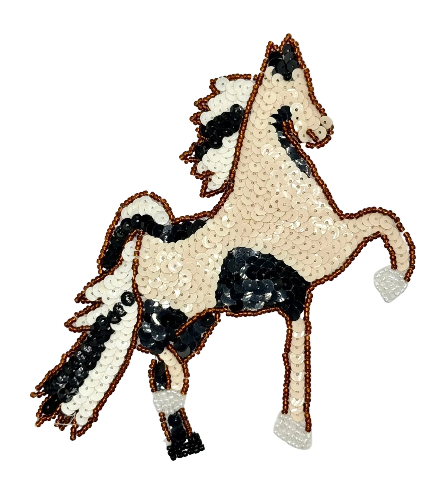 Decorative horse design made of sequins on a white background