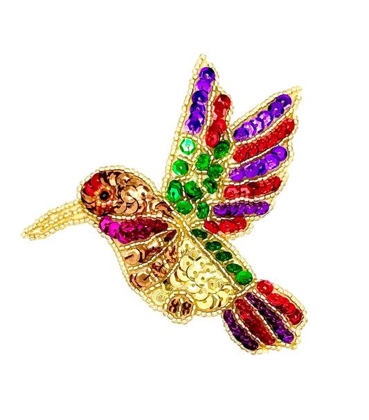 Colorful sequin and bead  hummingbird patch on a white background