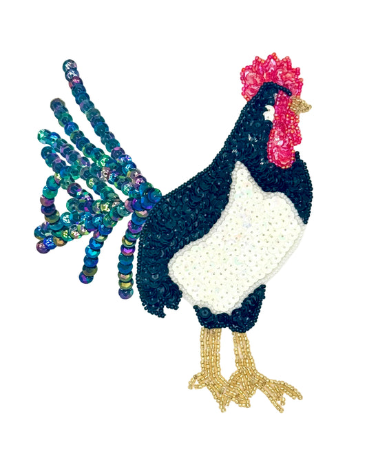 Decorative rooster with sequins and beads on a white background