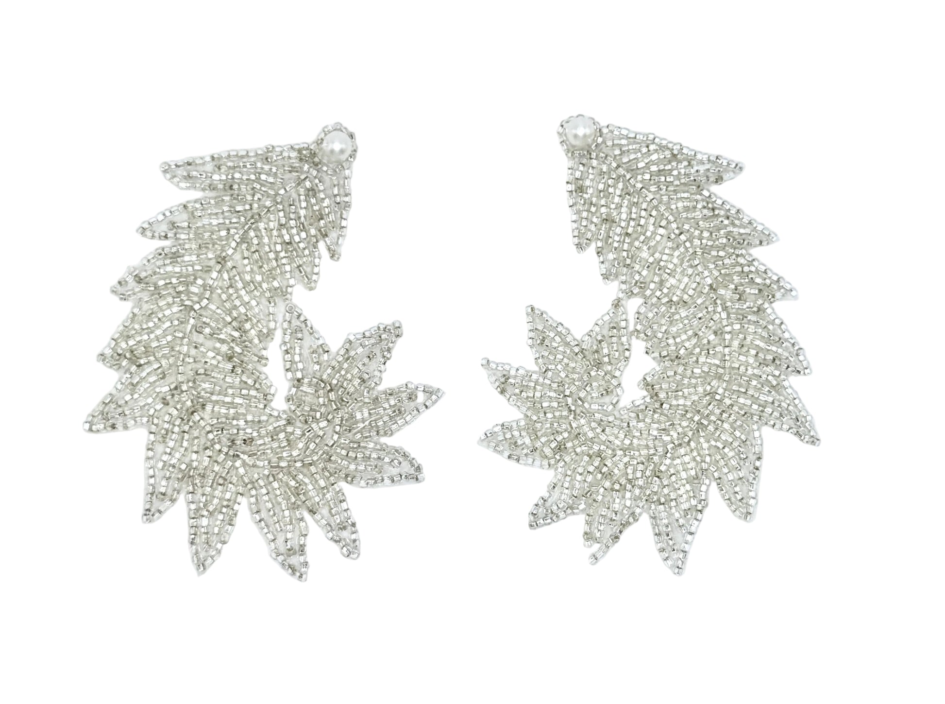 Pair of silver leaf-shaped patches on a white background