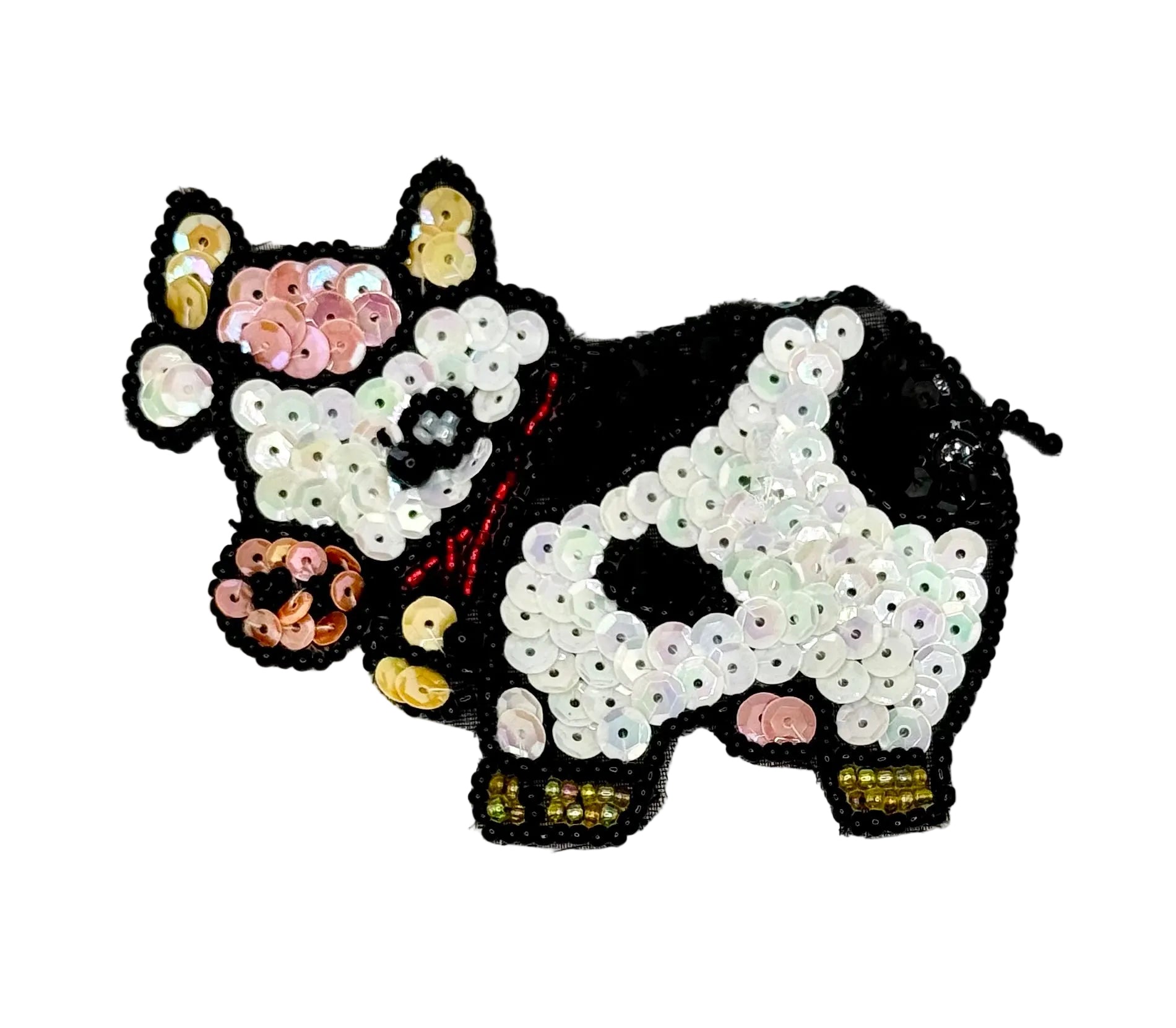Sequined black and white cow design on a white background