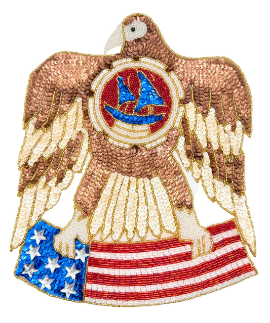 Decorative patch of an eagle holding an American flag on a white background