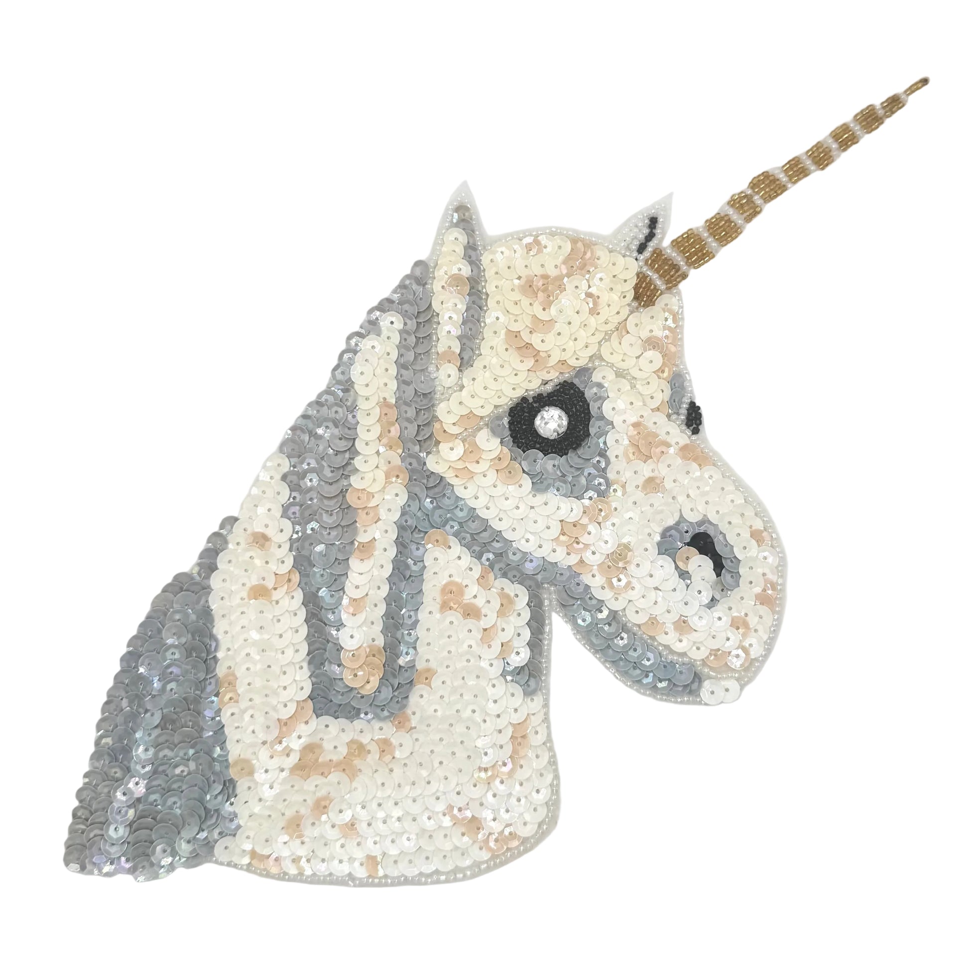 Sequined unicorn head with a gold horn on a white background