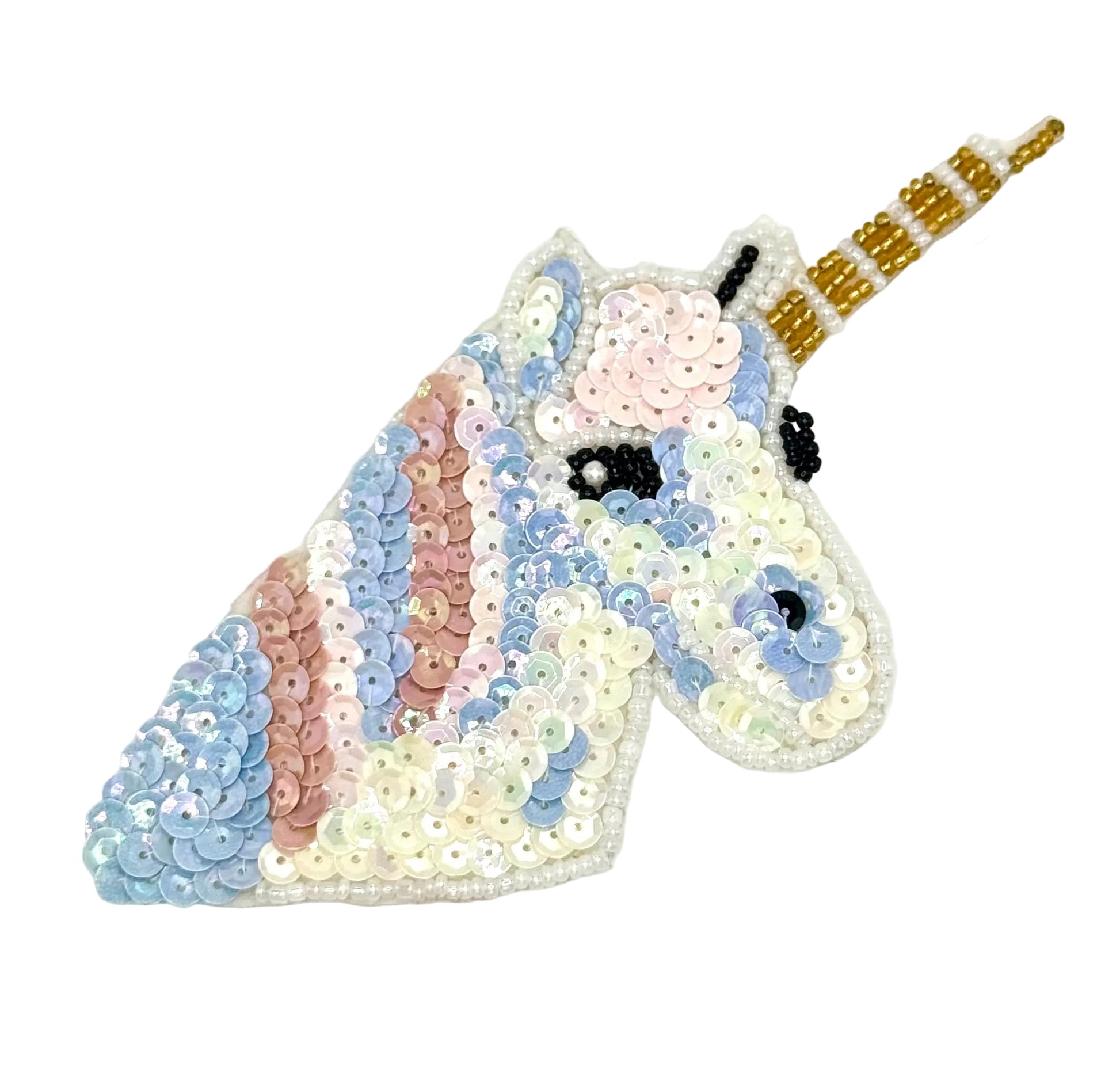 Sequined unicorn head with a gold horn on a white background